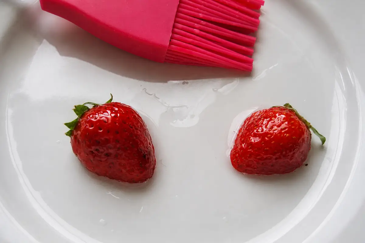 Strawberries brushed with melted gelatine for a glossy finish.