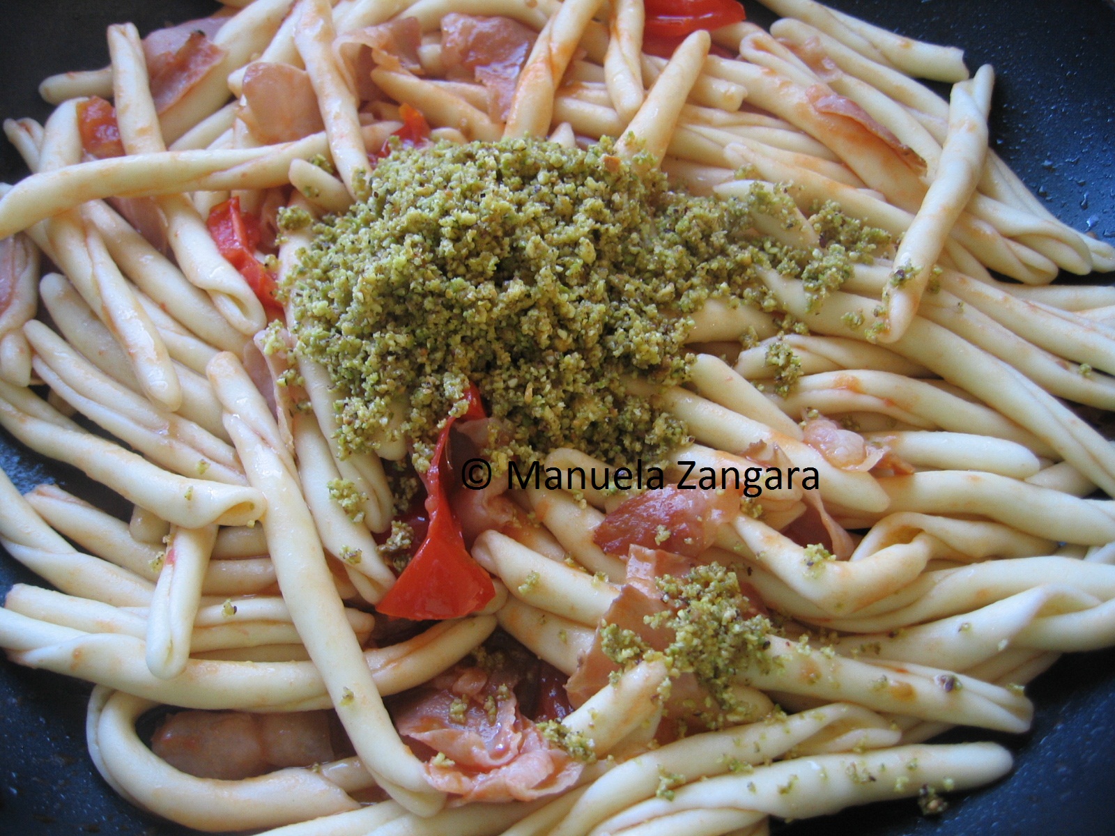Strozzapreti with speck and pistachio pesto