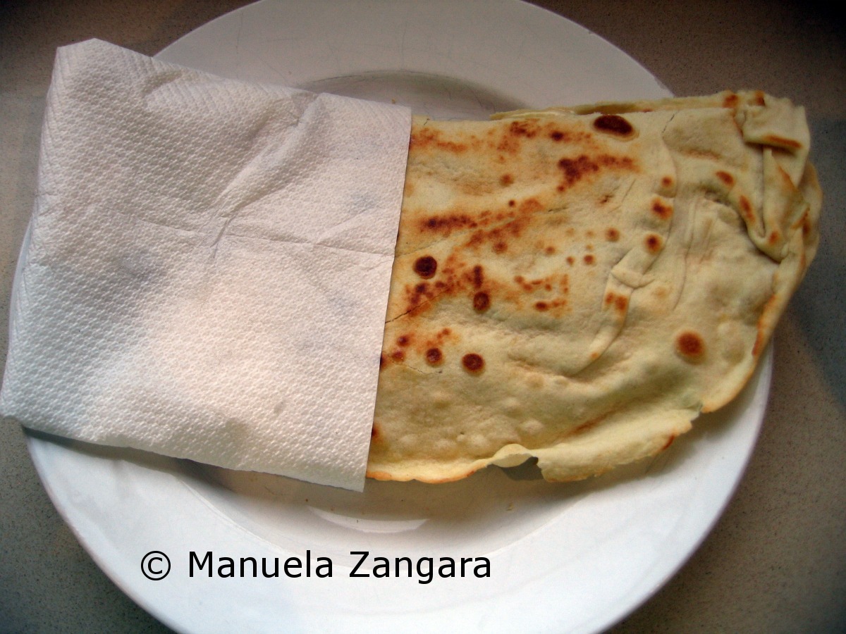 Homemade Piadina with prosciutto, stracchino and rocket