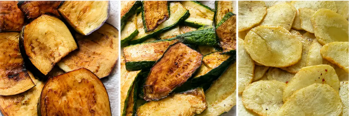 Fried eggplant, zucchini, and potato slices prepared for a Greek eggplant bake.