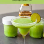 Frozen margarita in a salted glass with lime garnish.