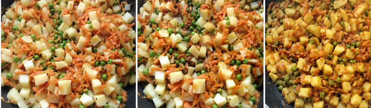 Curried potato filling cooking with carrots, peas, and sauce in a frying pan.