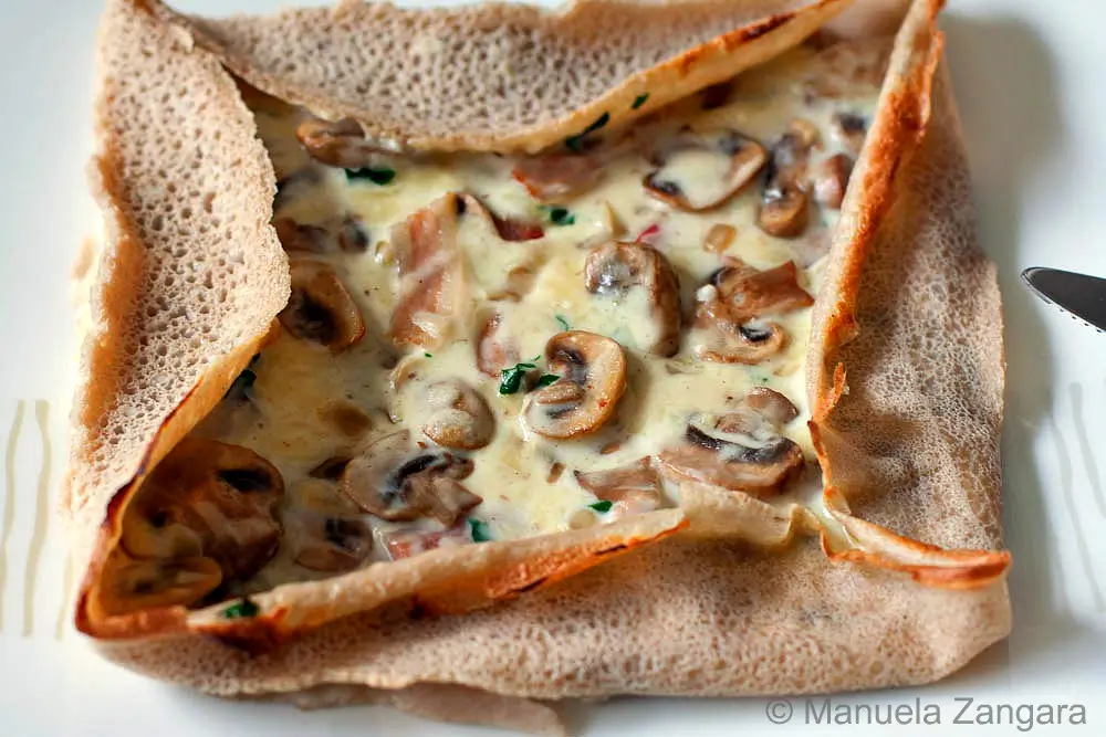 Close-up of the finished Galette Bretonne à la Forestière showing its crisp edges and creamy centre.