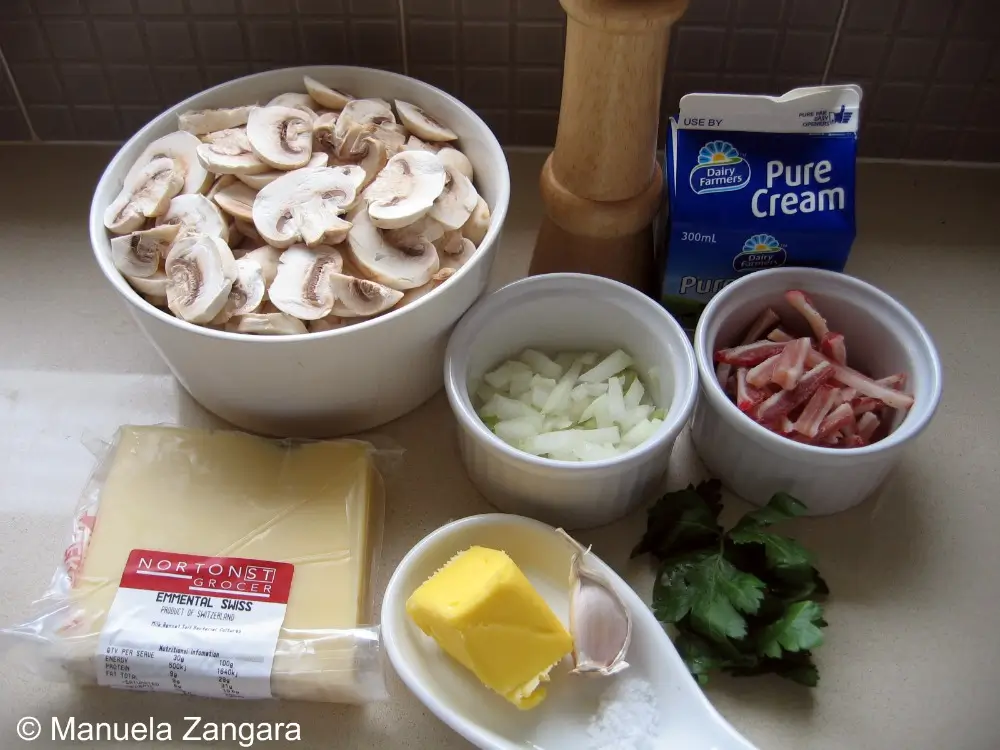 Ingredients for the mushroom and pancetta filling arranged on the counter.