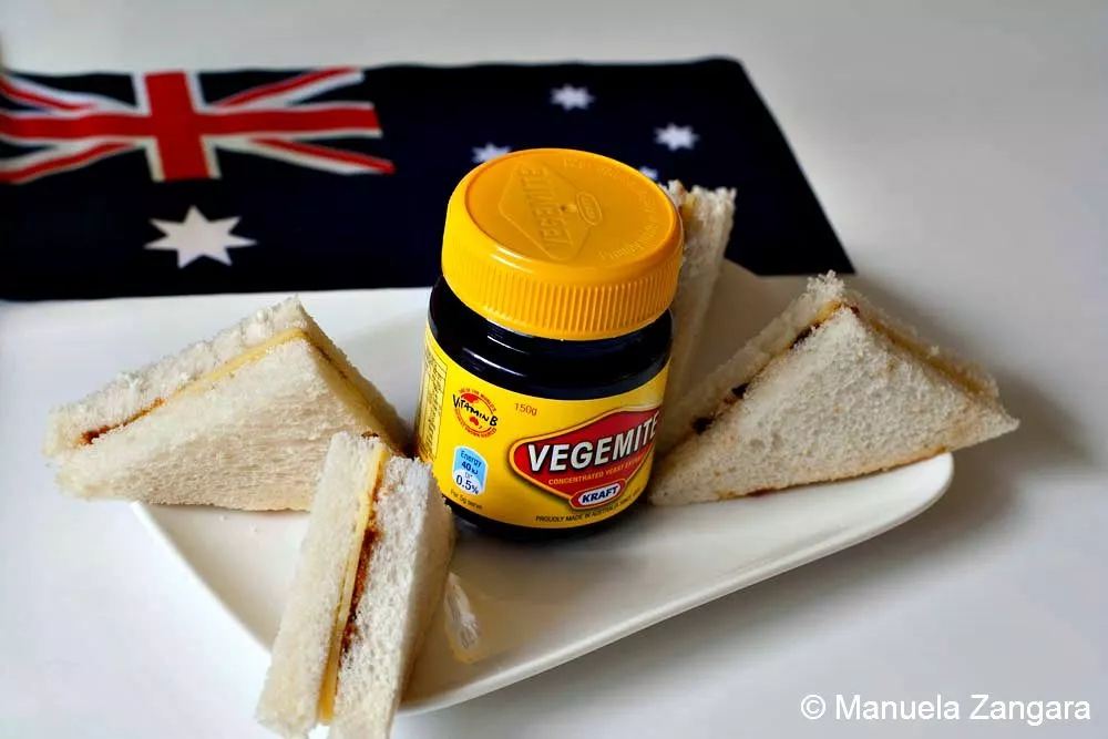 Mini Vegemite and Cheese Sandwiches Vegemite and cheese sandwiches on a plate with an Australian flag in the background.