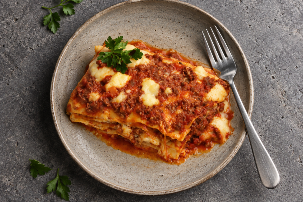 Close-up of Baked Lasagne with layers of pasta, meat sauce and melted cheese.