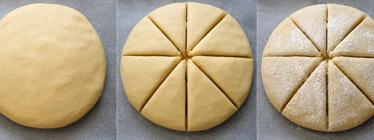 Damper dough shaped, scored into wedges, and dusted with flour before baking.