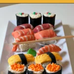 Assembled sweet sushi pieces arranged on a serving plate.