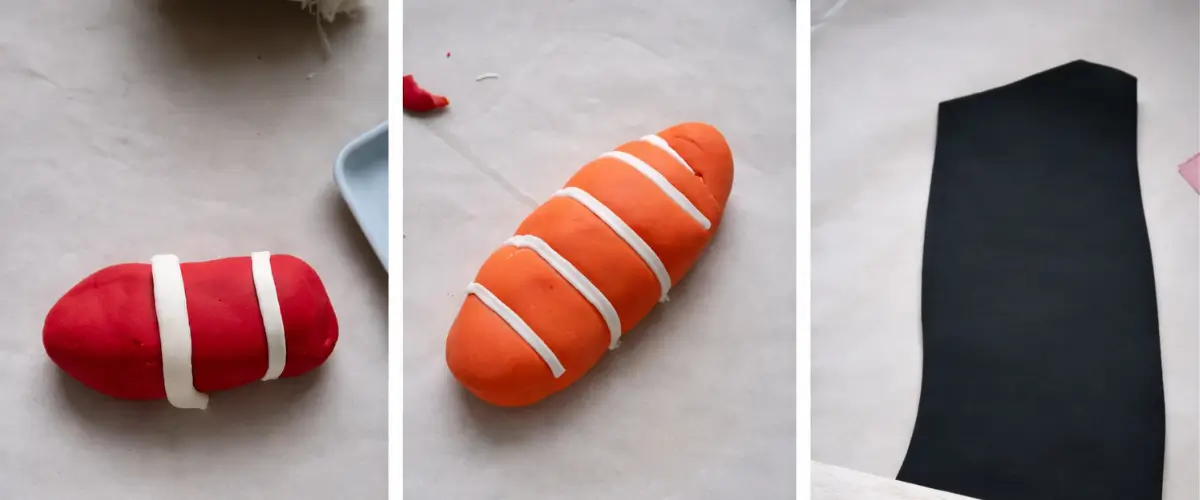 Red and orange fondant shaped into fish pieces alongside a sheet of dark fondant for wrapping.