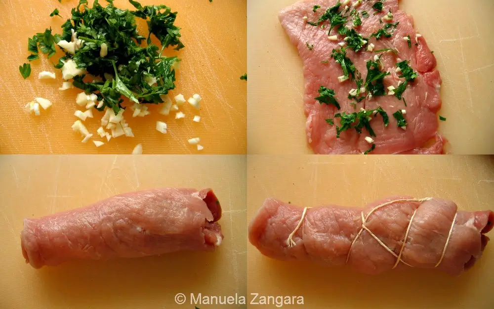 Garlic and parsley being spread over pork schnitzel before rolling into braciole.