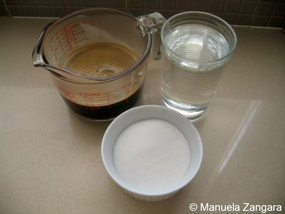 Ingredients for Granita al Caffè con Panna on a kitchen counter.