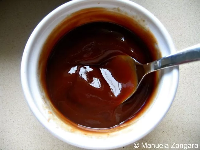 Small bowl of homemade Kilpatrick sauce made with ketchup and Worcestershire sauce.