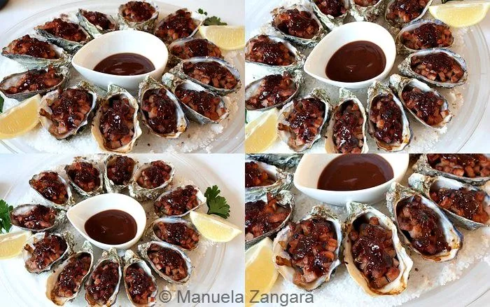 Plated Oysters Kilpatrick arranged on coarse salt with lemon wedges and Kilpatrick sauce in the centre.