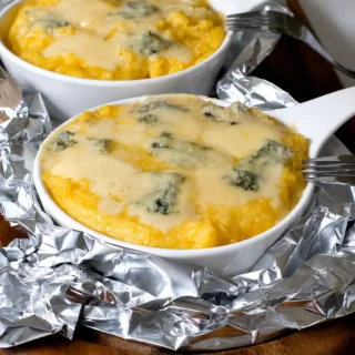 Polenta Concia layered with melted Gorgonzola, Fontina, and Parmigiano Reggiano.