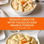 Homemade potato gnocchi coated in creamy taleggio sauce with orange zest.