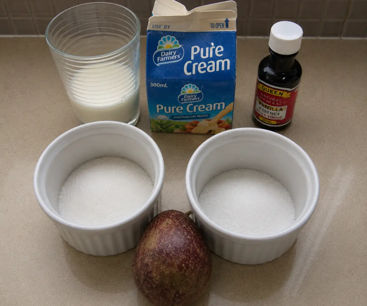 Cream, milk, sugar, vanilla, and passion fruit prepared for Passion Fruit Panna Cotta with Vanilla Cream.
