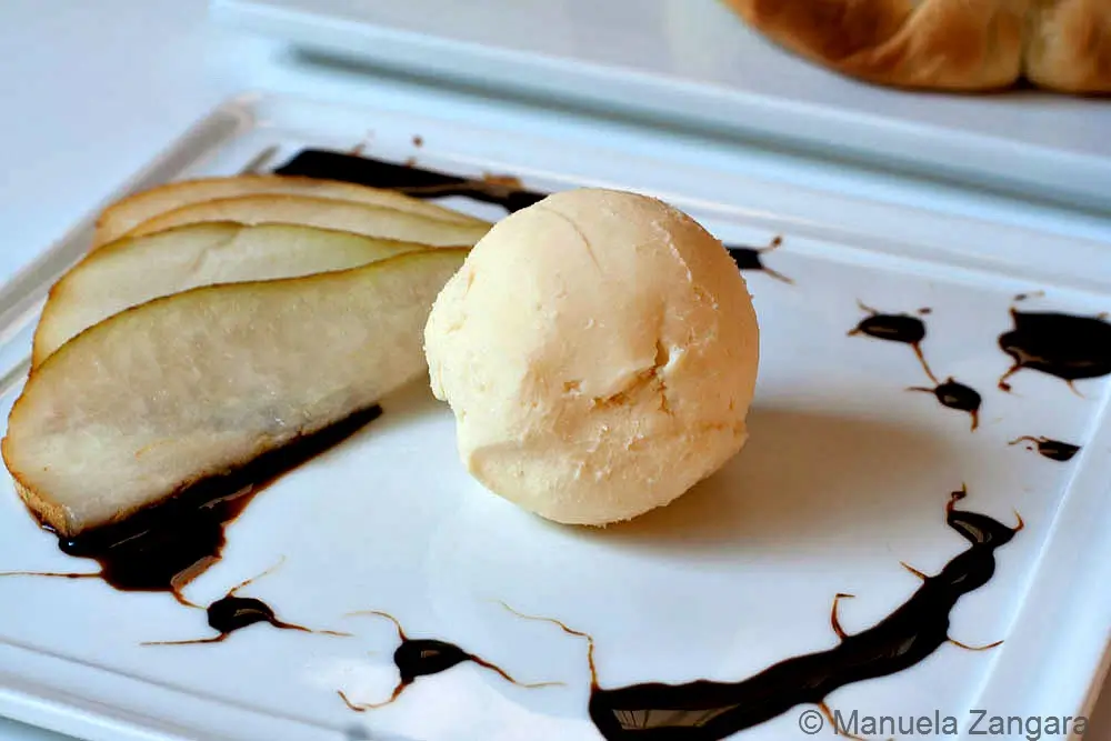 Parmigiano Reggiano Gelato served with sliced pear and balsamic drizzle.