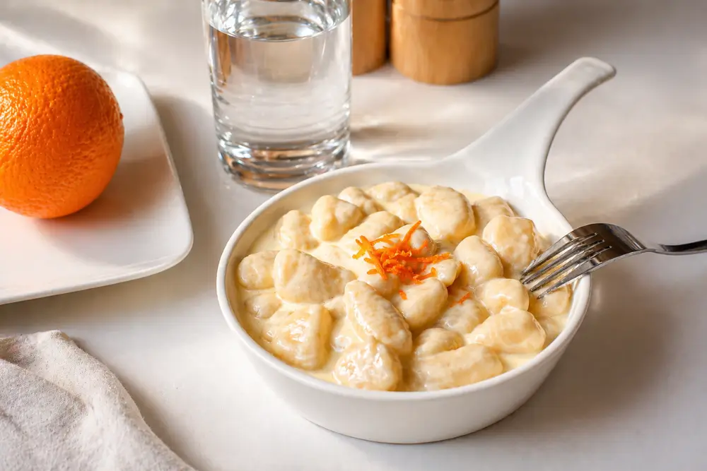 Potato Gnocchi with Taleggio and Orange Fondue topped with fresh orange zest.