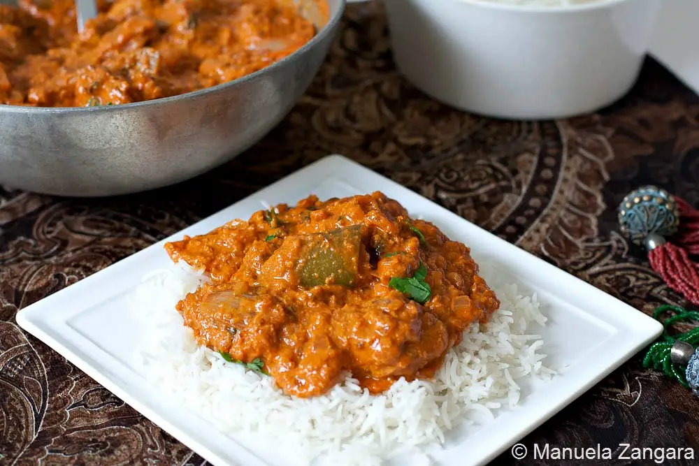 Creamy tomato-based curry served over basmati rice.