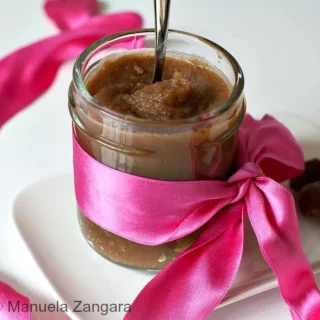 Homemade Crème de Marrons Vanillée, a smooth chestnut and vanilla cream in a glass jar wrapped with a pink ribbon.