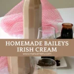 Bottle of homemade Baileys Irish Cream with a glass and coffee syrup on the side.