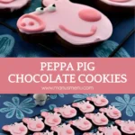 A full tray of decorated Peppa Pig Chocolate Cookies displayed on a patterned tablecloth.