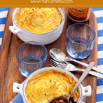 Baked Shepherd’s Pie with golden mashed potato topping served in individual dishes.