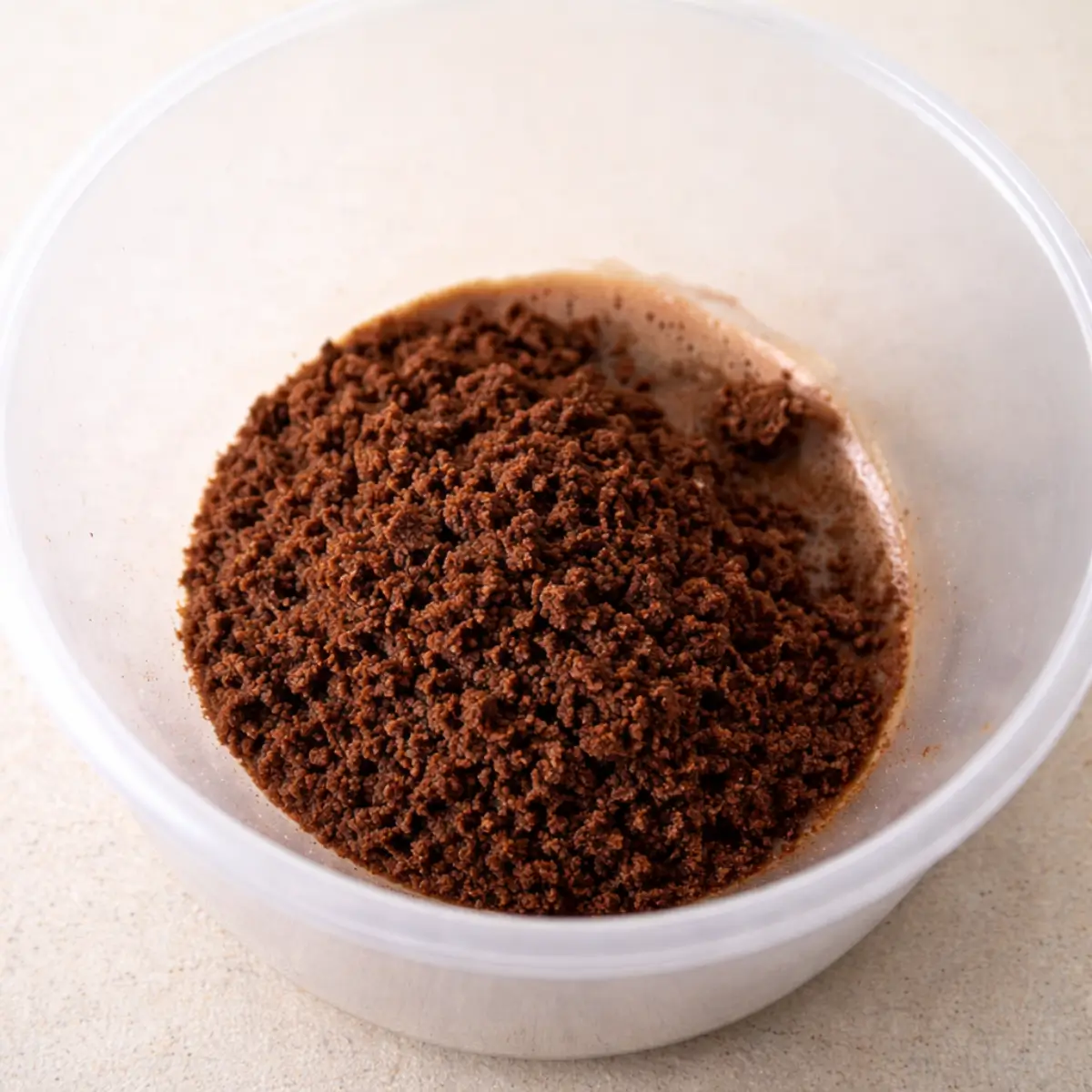 Crushed chocolate cookie crumbs mixed with a little moisture to create a soil-like texture.
