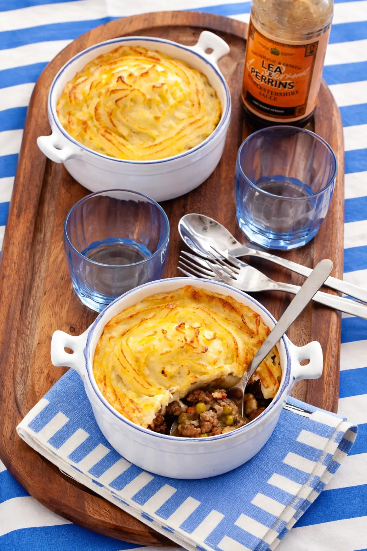 Baked Shepherd’s Pie with golden mashed potato topping served in individual dishes.