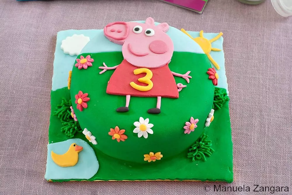 Peppa Pig Cake Finished Peppa Pig birthday cake covered in fondant.