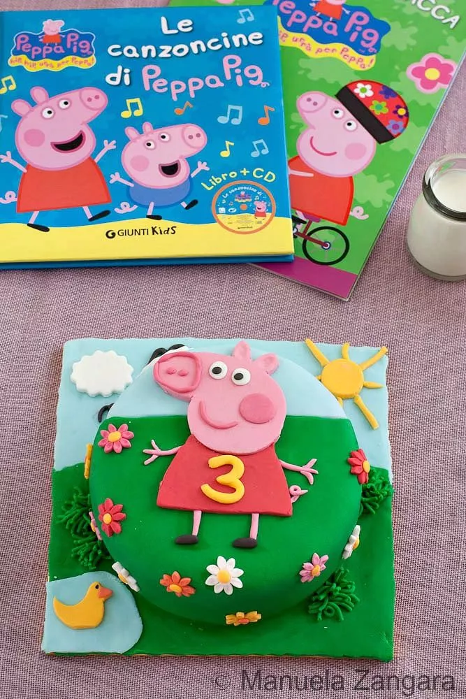 Peppa Pig Cake Peppa Pig cake tutorial result, a fondant birthday cake with Peppa’s face and a number three decoration.