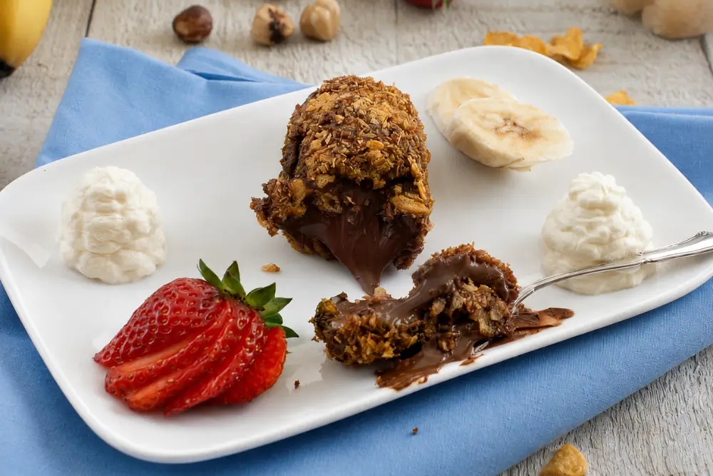 Crispy Nutella dessert cut open with a warm chocolate-hazelnut centre.