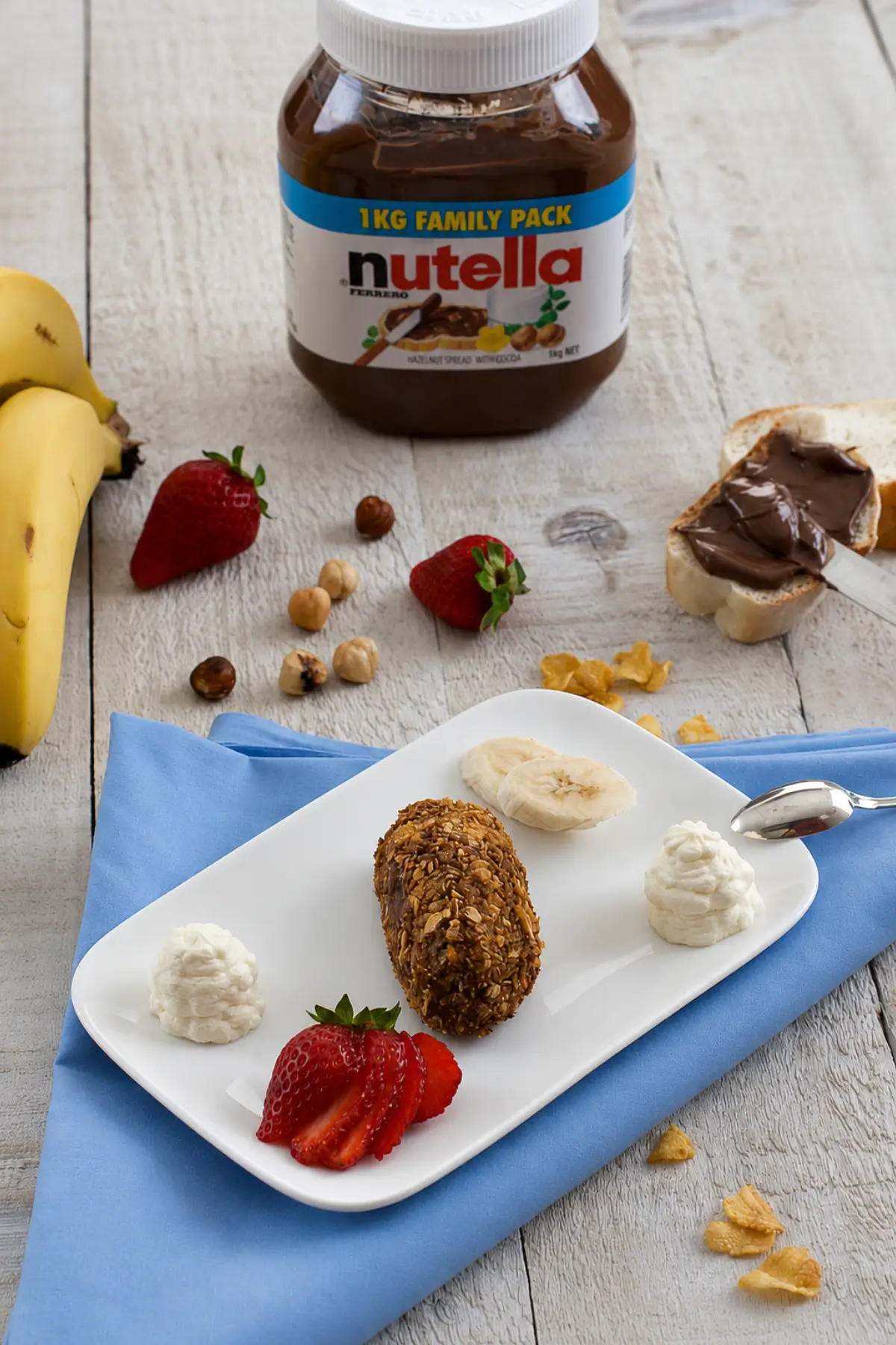 Fried Nutella served with strawberries, banana, and whipped cream.