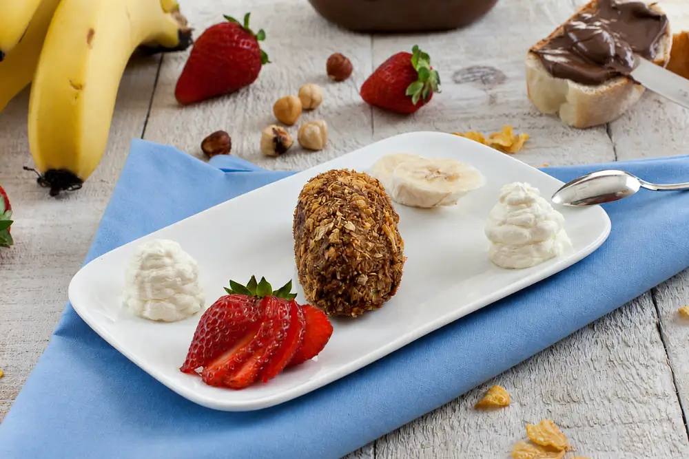 Hardened Nutella shaped with a hazelnut pressed into the centre.