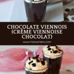 Glasses of Chocolate Viennois with Chantilly and chocolate shards on top, set on a white plate.