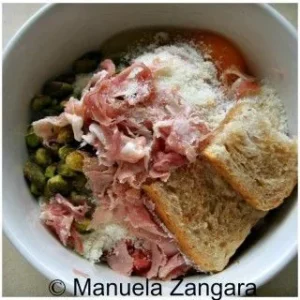 Mixing bread, pistachios, prosciutto, and egg for the chicken ballotine filling.