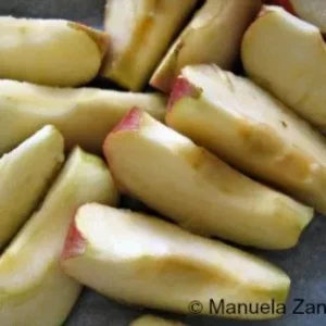 Fresh apple wedges prepared for roasting with the chicken ballotine.