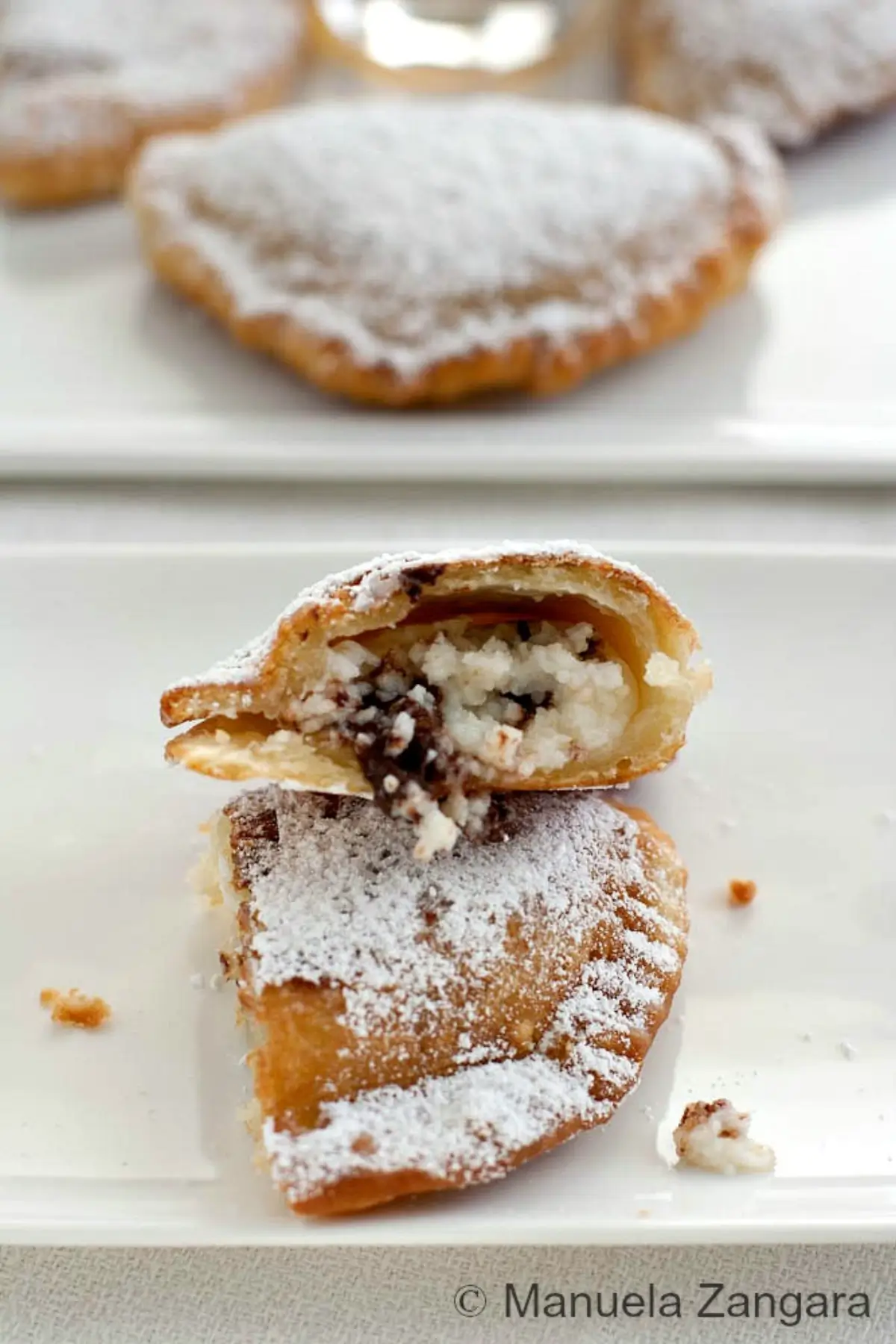 Fried cassatella cut open to show the ricotta and chocolate filling.