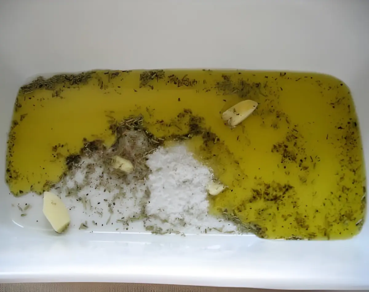 Olive oil, garlic, salt and rosemary mixed together for the marinade.