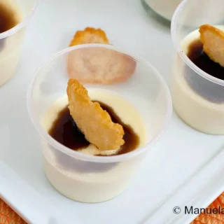 Parmigiano Reggiano Panna Cotta served in small cups with balsamic glaze and crisp cheese hearts.