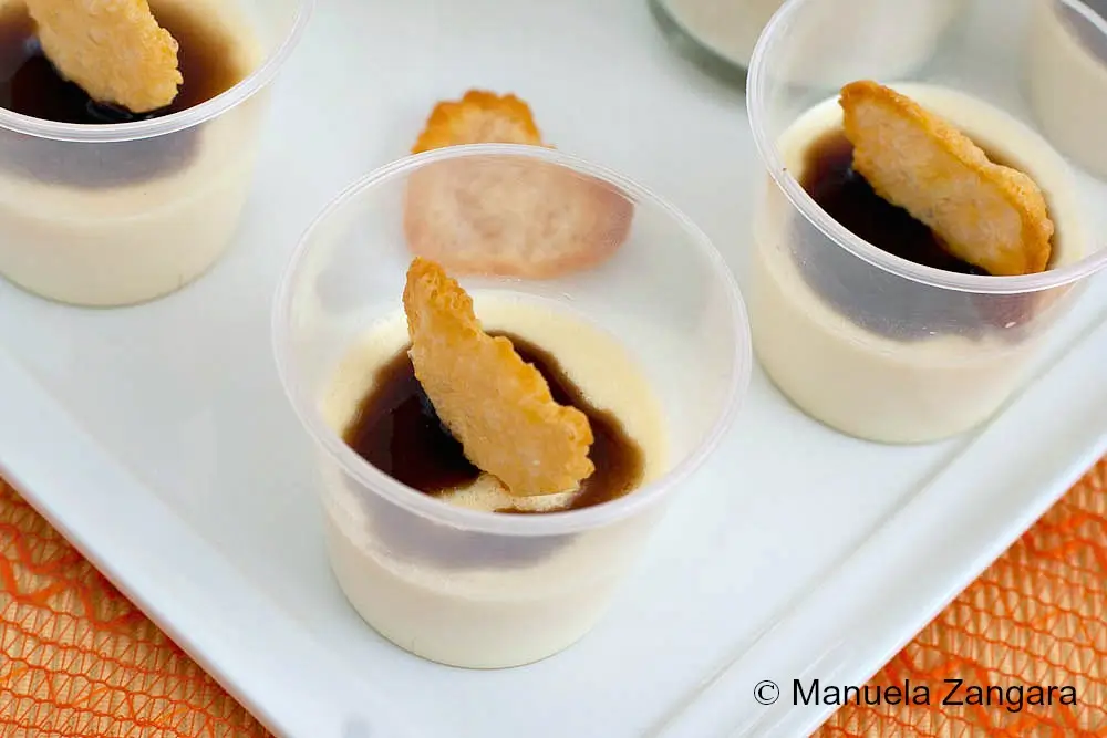 Parmigiano Reggiano Panna Cotta served in small cups with balsamic glaze and crisp cheese hearts.