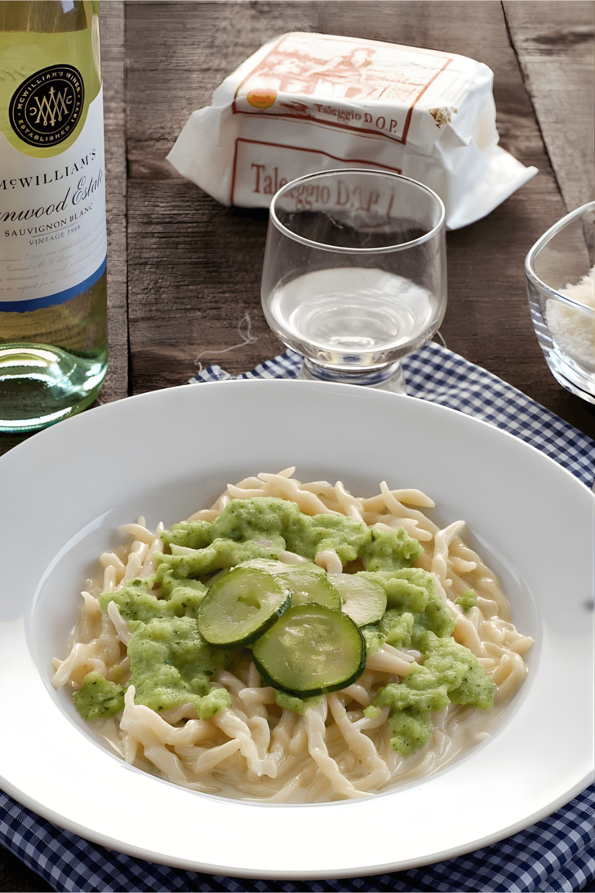 Plate of trofie pasta with Taleggio fondue and zucchini cream.
