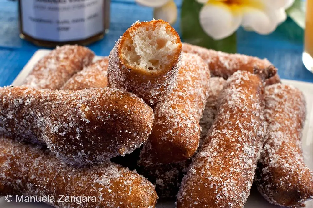 A close-up of Firi Firi with one piece bitten open to show the soft inside.