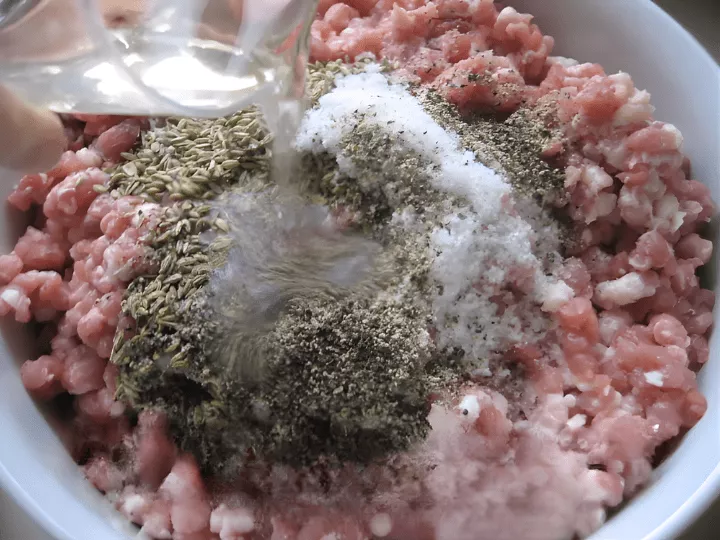 Ground pork mixed with fennel seeds, salt, pepper, and white wine for traditional Sicilian pork sausage.