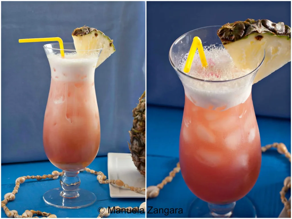 Two glasses of Mai Tai topped with frothy pineapple mix and a pineapple wedge.