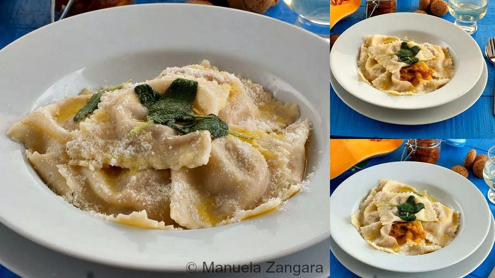 Tortelli di Zucca served on a white plate with sage butter and grated cheese.