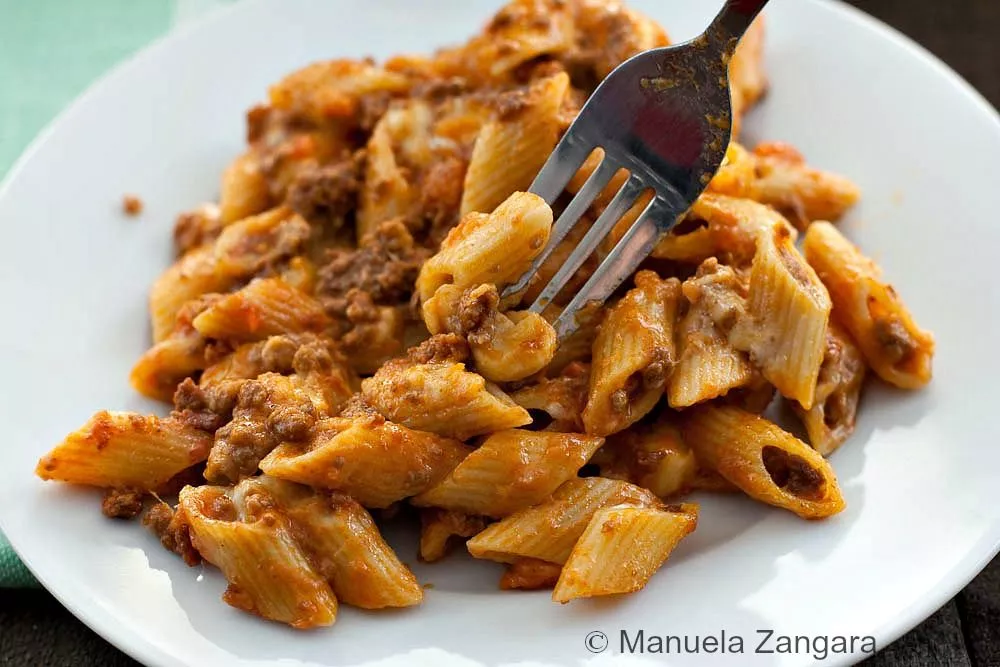 Close-up of Pasta al Forno on a white plate.