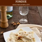 Soft mezzelune coated in creamy cheese sauce on a white plate.