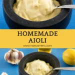 Bowl of creamy garlic aioli served with fresh garlic, lemon and olive oil on a wooden table.