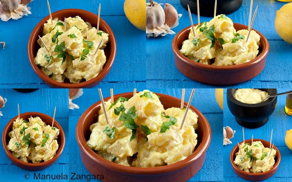 Close-up of Patatas Alioli in a terracotta bowl topped with parsley.